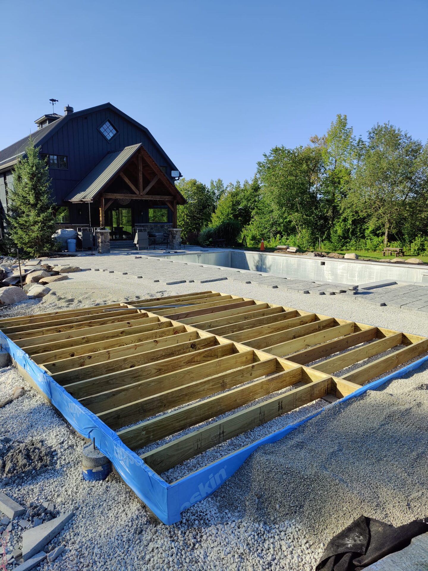 this image shows the foundation of a pool house being built